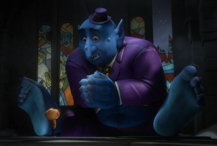 Duża niebieska animowana istota w fioletowym garniturze i kapeluszu siedzi boso na podłodze, trzymając ręce razem, naprzeciwko znacznie mniejszej postaci w brązowym ubraniu w słabo oświetlonym pokoju z witrażowymi oknami.