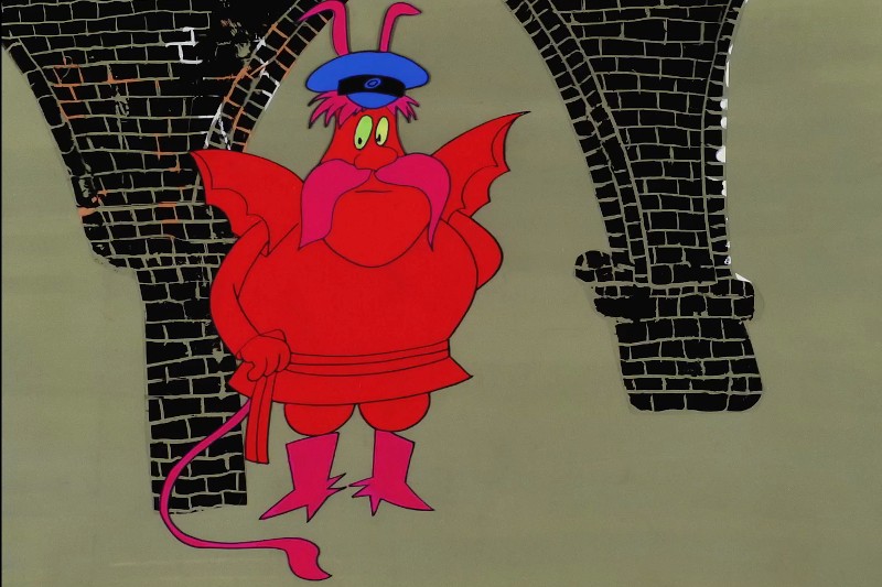 Czerwona postać z kreskówki ze skrzydłami nietoperza, różowymi wąsami i czułkami nosi niebieski kapelusz i różowe buty, stoi na tle czarnych ceglanych łuków.