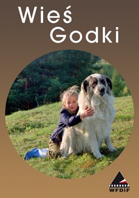 Małe dziecko o blond włosach przytula dużego, puszystego, biało-szarego psa, siedząc na trawie, z drzewami w tle. Biały tekst u góry brzmi Wieś Godki. Logo znajduje się w prawym dolnym rogu.