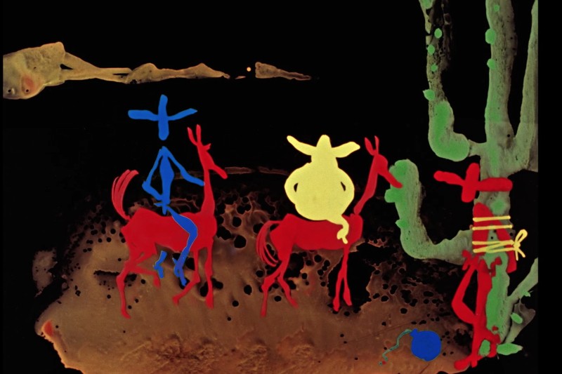 Kolorowe, abstrakcyjne postacie w kolorze niebieskim, czerwonym i żółtym wydają się jeździć na czerwonych zwierzętach w pobliżu dużego, zielonego kaktusa. Całość osadzona jest na ciemnym, ziemistym tle w surrealistycznym, malowanym stylu.