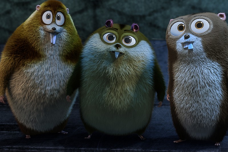 Trzy animowane, pulchne chomiki z dużymi oczami i wystającymi zębami stoją obok siebie na ciemnej podłodze, patrząc do przodu ze zdziwionymi minami. Kolor ich futra waha się od brązowego do szarozielonego.