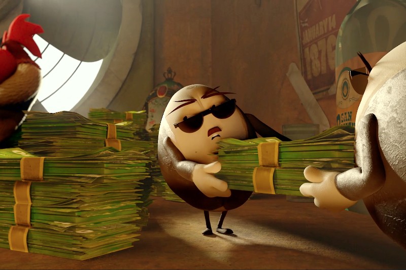Animowana postać przedstawiająca jajko, nosząca okulary przeciwsłoneczne, z trudem dźwiga dużą stertę pieniędzy w słabo oświetlonym pomieszczeniu, otoczona przez jeszcze większe stosy gotówki i inne postacie przedstawiające jajka.