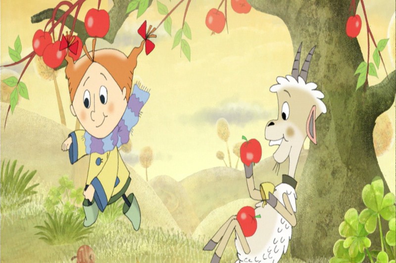 Radosna dziewczynka z kreskówki z czerwonymi warkoczykami sięga po jabłka na drzewie, podczas gdy uśmiechnięta koza siedzi w pobliżu, trzymając jabłko. Scena rozgrywa się w trawiastym, kapryśnym krajobrazie.