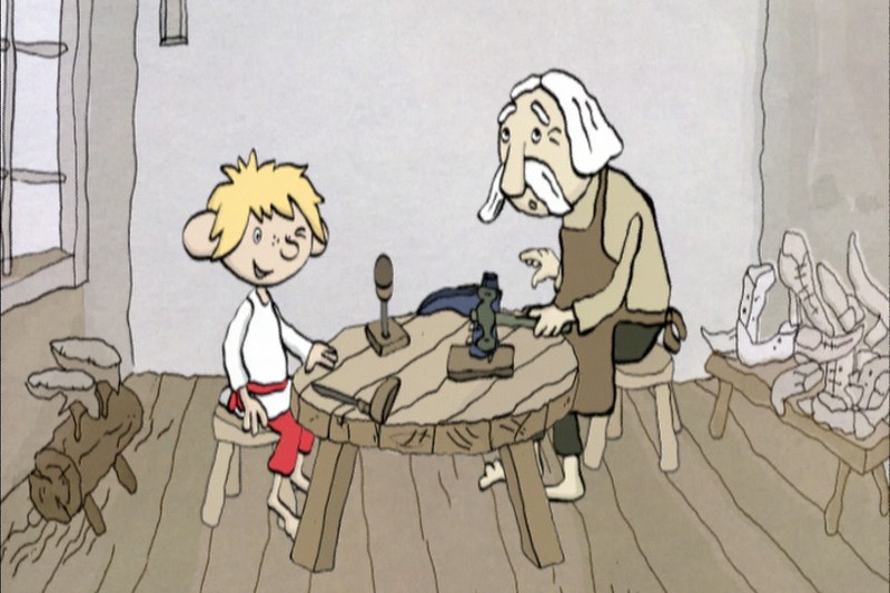 Chłopiec z kreskówki i starszy mężczyzna z białymi włosami siedzą przy drewnianym stole w prostym pokoju. Mężczyzna pracuje nad butami, mając wokół siebie narzędzia i gotowe buty. Chłopiec się uśmiecha, ubrany w białą koszulę i czerwone spodnie.