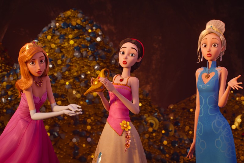 Trzy animowane księżniczki w eleganckich sukienkach stoją przed stosami złota i klejnotów. Jedna trzyma magiczną lampę, podczas gdy inne wyglądają na zaskoczone i zdezorientowane. Tło jest wypełnione błyszczącymi skarbami.