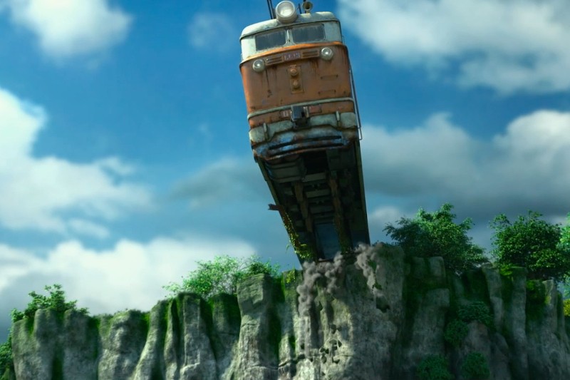 Pociąg dramatycznie wisi nad krawędzią skalistego klifu, a część torów kruszy się pod nim. Scena rozgrywa się pod jasnym niebem z chmurami i zielonym listowiem poniżej.