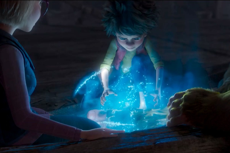 Animowane dziecko z nastroszonymi włosami i w czerwonej kamizelce dotyka świecącej, niebieskiej, magicznej substancji na ziemi, otoczone iskierkami, podczas gdy inni przyglądają się uważnie w ciemnym otoczeniu.