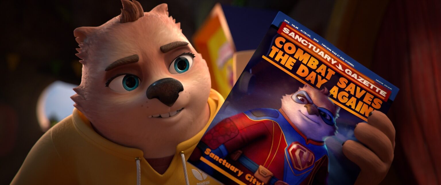 Animowana postać zwierzęcia w żółtej bluzie z kapturem trzyma magazyn z superbohaterską wersją siebie na okładce i nagłówkiem „Walka znów ratuje dzień”.