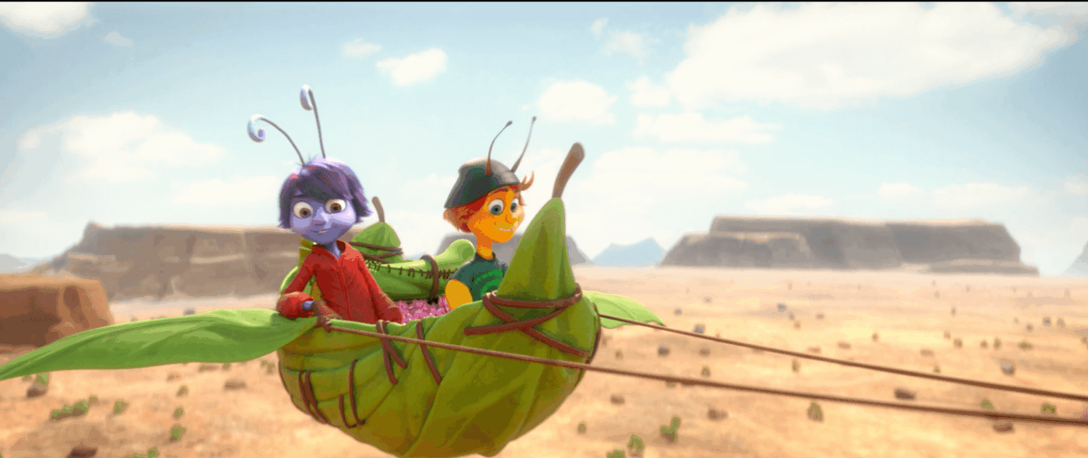 Dwie kolorowe animowane postacie owadów, jeden fioletowy i jeden pomarańczowy, siedzą razem na zielonym szybowcu w kształcie konika polnego, lecąc nad rozległym, rozświetlonym słońcem pustynnym krajobrazem ze wzgórzami w tle.